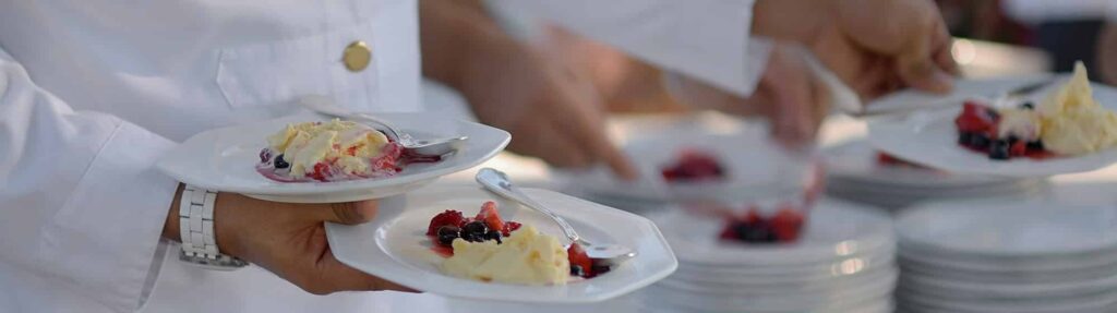 Hospitality Staffing Solutions | TemPositions Eden Hospitality | Chefs holding gourmet cuisine